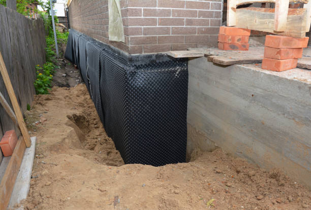SJ Waterproofing Pros technician performing targeted Interior Drainage System assessment in Wittenberg, WI